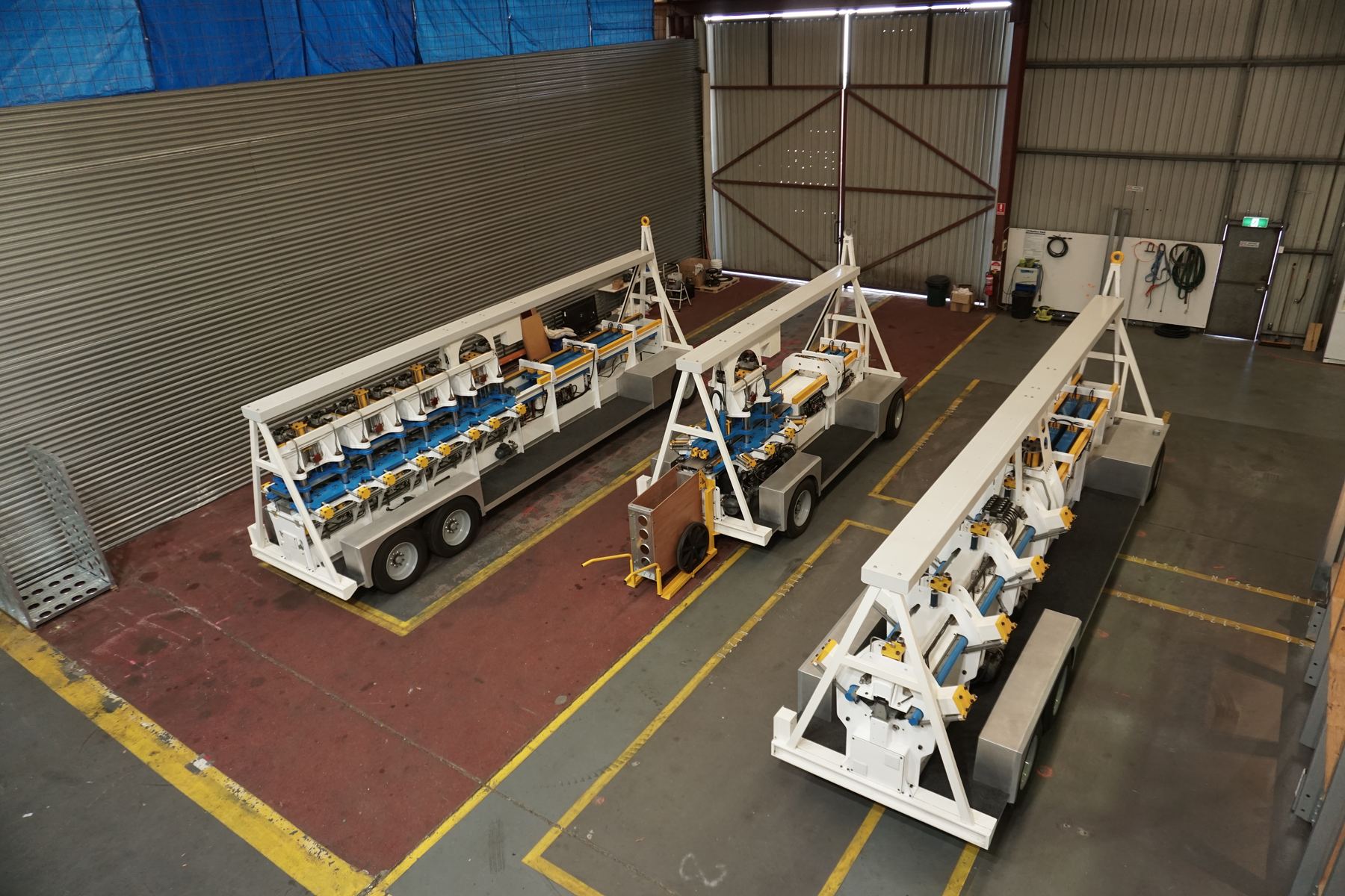 Three CoGrid forming machines staged in workshop